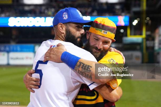 Jake Arrieta of the Hartford Schoolboys and Jonny Gomes of the Steamed Cheeseburgers embrace after the HRDX Hartford at Dunkin Park on Friday, August...