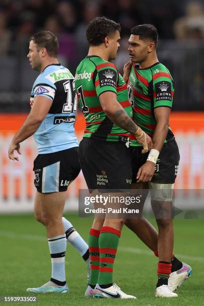 Latrell Mitchell of the Rabbitohs talks with Tyrone Munro after a losing the ball during the round 23 NRL match between South Sydney Rabbitohs and...