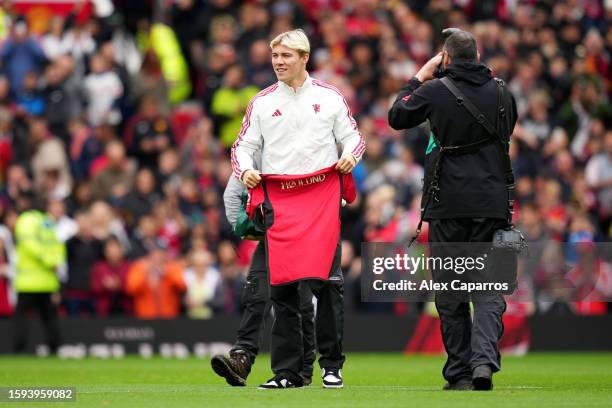 Rasmus Hoejlund of Manchester United reacts as he is unveiled as a new signing prior to the pre-season friendly match between Manchester United and...