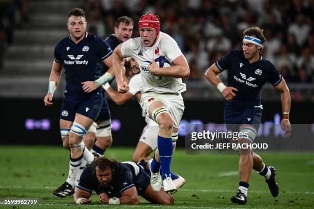 France's flanker Thibaud Flament runs with the ball during the pre-World Cup Rugby Union friendly match between France and Scotland at the...
