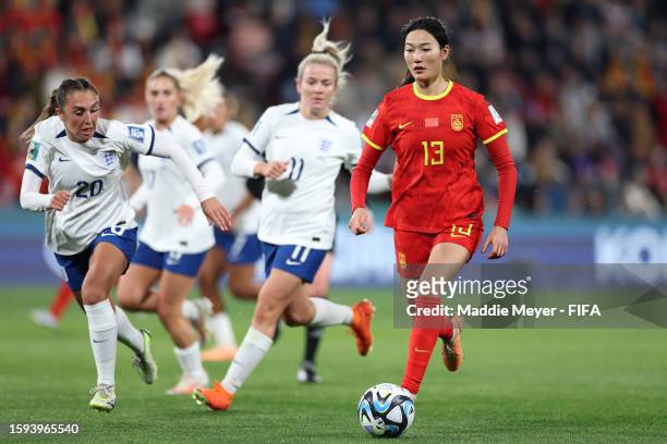 Yang Lina of China PR dribbles past Lauren Hemp of England during the FIFA Women's World Cup Australia & New Zealand 2023 Group D match between China...