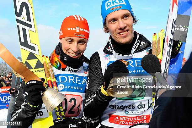 Eric Frenzel and Tino Edelmann of Germany take 1st place during the FIS Nordic Combined World Cup Team Sprint on January 13, 2013 in Chaux-Neuve,...