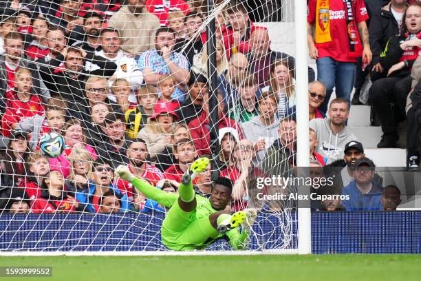 Andre Onana of Manchester United fails to save a shot from Florian Sotoca of RC Lens leading to the first goal for RC Lens during the pre-season...