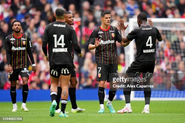 Florian Sotoca of RC Lens celebrates with teammates after scoring the team's first goal during the pre-season friendly match between Manchester...