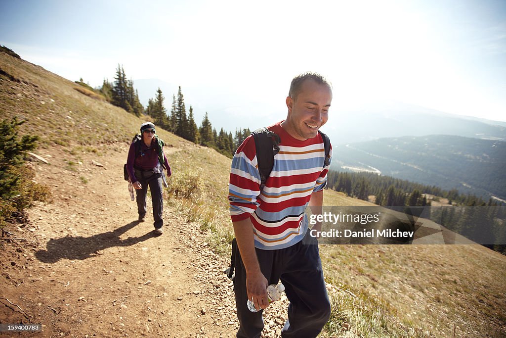 Couple hiking high in the rockies.