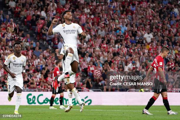 Real Madrid's Brazilian forward Rodrygo celebrates scoring the opening goal during the Spanish Liga football match between Athletic Bilbao and Real...