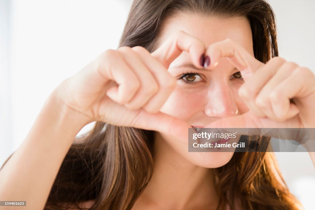 Woman making heart shape with her hands