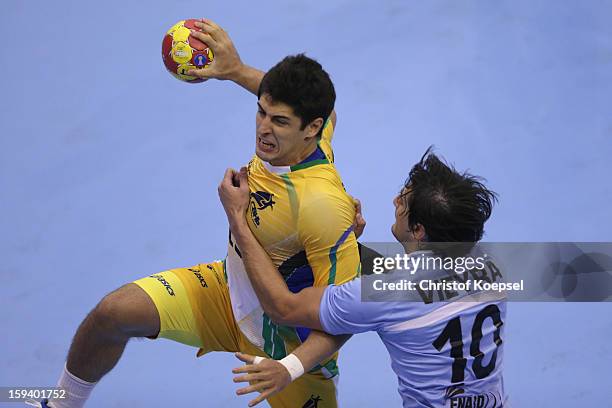 Frederico Vieyra of Argentina defends against Gil Pires of Brazil during the premilary group A match between Brasil and Argentina and Montenegro at...