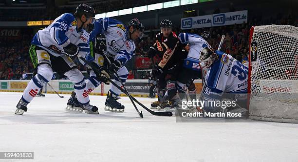 Ivan Ciernik of Hannover faisl to score over Jason Bacashihua , goaltender of Straubing during the DEL match between Hannover Scorpions and Straubing...
