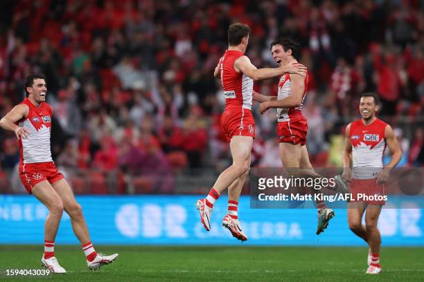 Chad Warner of the Swans celebrates with Errol Gulden of the Swans after kicking a goal during the round 21 AFL match between Greater Western Sydney...