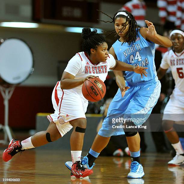 Myisha Goodwin-Coleman of the North Carolina State Wolfpack dribbles against Tierra Ruffin-Pratt of the North Carolina Tar Heels at Reynolds Coliseum...