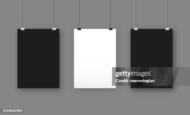 black and white blank posters hanging with paper clips. a4 paper page, sheet on wall - mockup print stock illustrations