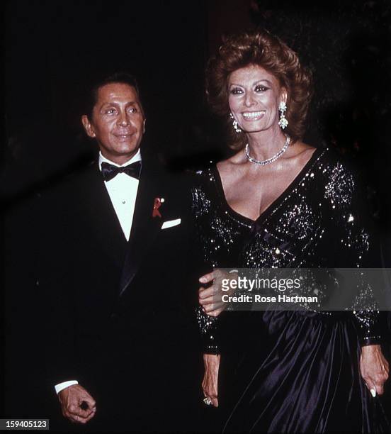 The designer Valentino Garavani with actress Sophia Loren, at a Valentino party, at the Park Avenue Armory, New York, New York, 1992.