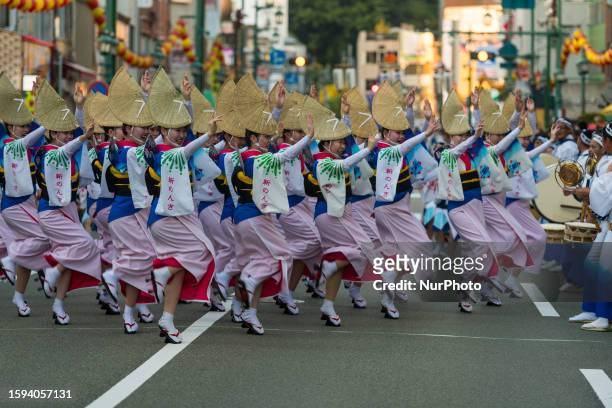 Group of dancers is performing the Awa Odori dance during the Tokushima eponymous festival in Tokushima, Japan on August 12th, 2023.