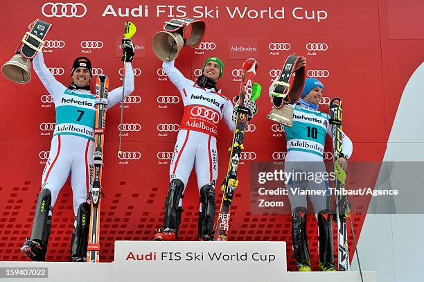 Marcel Hirscher of Austria takes 1st place, Mario Matt of Austria takes 2nd place, Manfred Moelgg of Italy takes 3rd place during the Audi FIS Alpine...