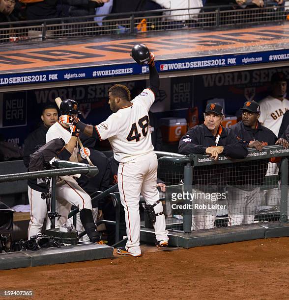 Pablo Sandoval of the San Francisco Giants acknowledges the crowd after hitting his third home run of Game One of the 2012 World Series in the bottom...