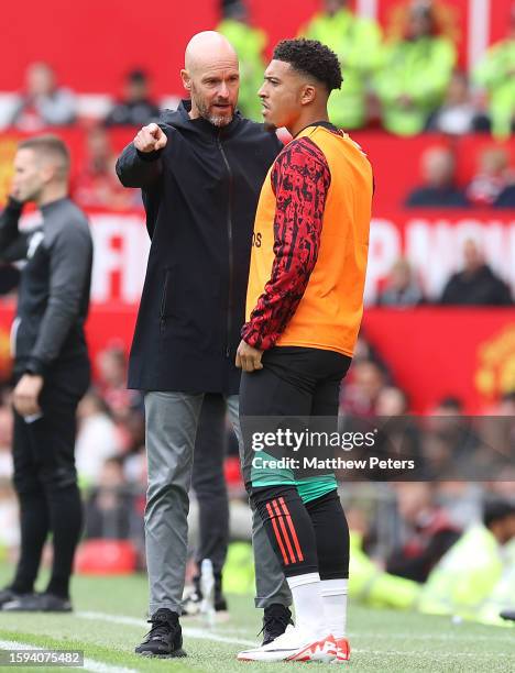 Manager Erik ten Hag of Manchester United talks to Jadon Sancho during the pre-season friendly match between Manchester United and RC Lens at Old...