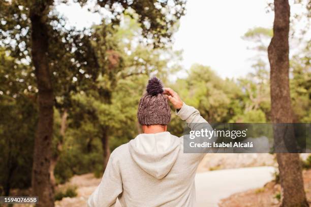 rear view of a man in the forest - alcoy spain stock pictures, royalty-free photos & images