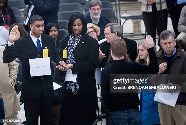 Air Force Staff Sargent Serpico Elliott and Army Specialist Delandra Rollins stand in for US President Barack Obama and US first lady Michelle Obama...