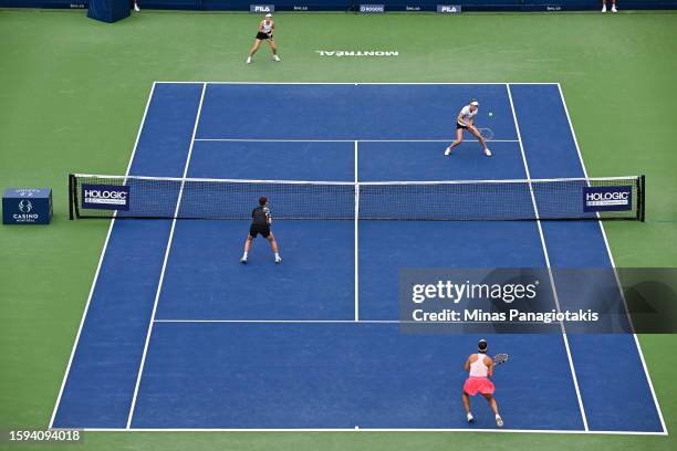 Storm Hunter of Australia and Elise Mertens of Belgium compete in their doubles match against Desirae Krawczyk of the United States of America and...