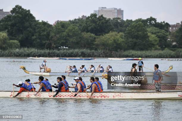 People are seen on the dragon-headed boat during the Hong Kong Dragon Boat Festival held at the Flushing Meadows-Corona Park in New York, United...