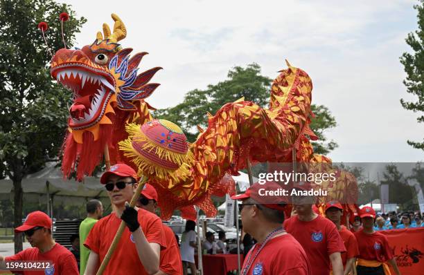 People are seen during the Hong Kong Dragon Boat Festival held at the Flushing Meadows-Corona Park in New York, United States on August 12, 2023. The...