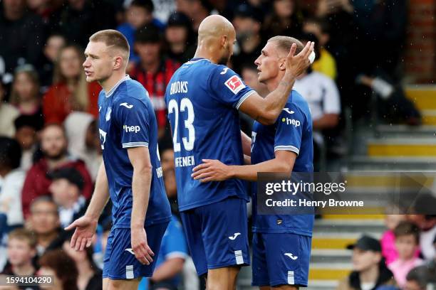 Grischa Proemel of TSG 1899 Hoffenheim celebrates with teammate John Brooks after scoring the team's first goal during the pre-season friendly match...