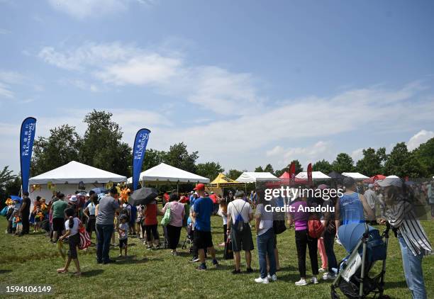 People are seen during the Hong Kong Dragon Boat Festival held at the Flushing Meadows-Corona Park in New York, United States on August 12, 2023. The...