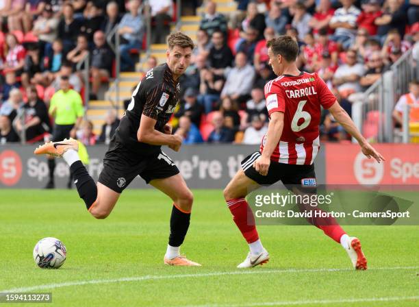 Blackpool's Jake Beesley and Exeter City's Tom Carroll during the Sky Bet League One match between Exeter City and Blackpool at St James Park on...