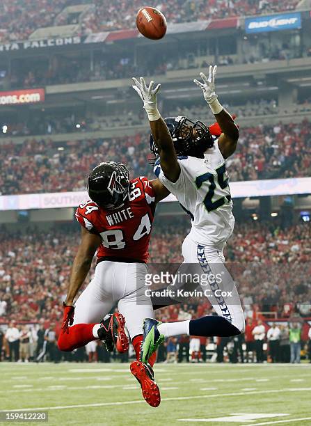 Richard Sherman of the Seattle Seahawks breaks up a pass intended for Roddy White of the Atlanta Falcons during the NFC Divisional Playoff Game at...