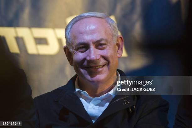 Israeli Prime Minister Benjamin Netanyahu, head of the Likud-Beitenu Party, smiles as he attends an electoral campaign on January 13 in the...