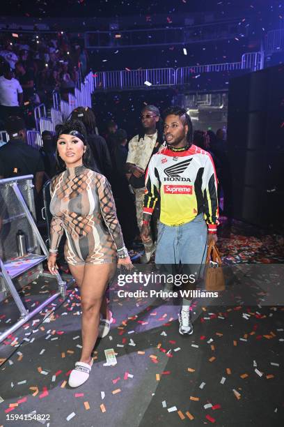 Ariana Fletcher and Arrogant Tae attend MoneyBagg Yo Larger Than Life Tour at State Farm Arena on August 4, 2023 in Atlanta, Georgia.