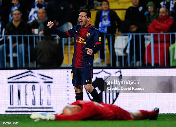 Lionel Messi of FC Barcelona celebrates after scoring the opening goal during the La Liga match between Malaga CF and FC Barcelona at La Rosaleda...