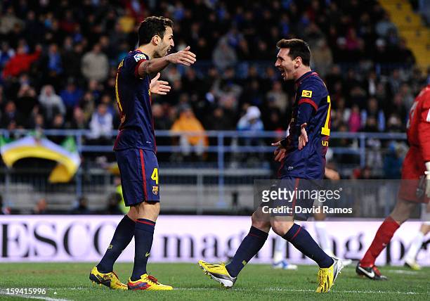 Cesc Fabregas of FC Barcelona celebrates with his teammate Lionel Messi of FC Barcelona after scoring his team's second goalduring the La Liga match...