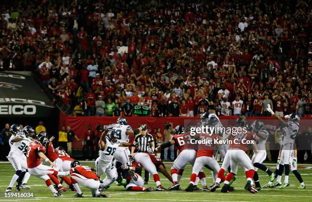 Matt Bryant of the Atlanta Falcons kicks the game winning field goal in the fourth quarter against the Seattle Seahawks during the NFC Divisional...