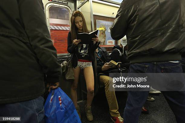 People ride the subway pantless on January 13, 2013 in New York City. Thousands of people participated in the 12th annual No Pants Subway Ride,...