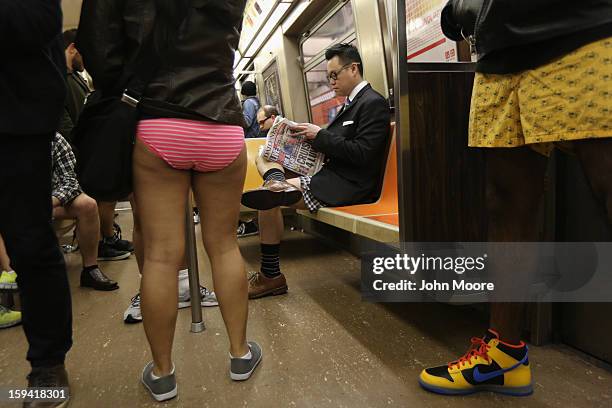 People ride the subway pantless on January 13, 2013 in New York City. Thousands of people participated in the 12th annual No Pants Subway Ride,...