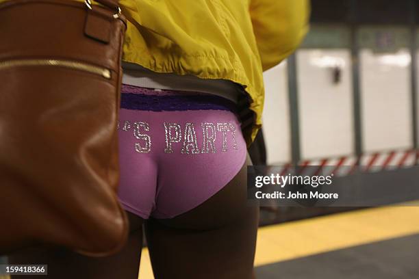 Pantless woman stands on a subway platform on January 13, 2013 in New York City. Thousands of people participated in the 12th annual No Pants Subway...