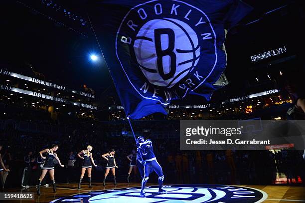 The BrooklyKnight and the Brooklynettes get the crowd pumped up for the game at the Barclays Center on January 13, 2013 in Brooklyn, New York. NOTE...