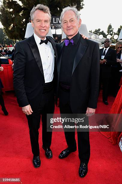 70th ANNUAL GOLDEN GLOBE AWARDS -- Pictured: Actors Tate Donovan and Victor Garber arrive to the 70th Annual Golden Globe Awards held at the Beverly...