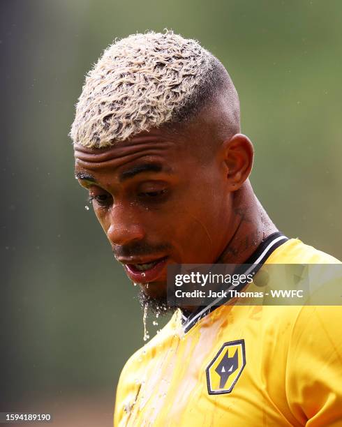 Mario Lemina of Wolverhampton Wanderers splashes water on his face ahead of the pre-season friendly match between Wolverhampton Wanderers and Stade...