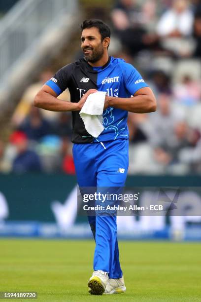 Ravi Bopara of London Spirit dries the ball during The Hundred match between Manchester Originals Men and London Spirit Men at Emirates Old Trafford...