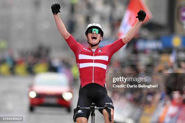 Albert Withen Philipsen of Denmark celebrates at finish line as gold medal winner during the men's junior road race at the 96th UCI Glasgow 2023...