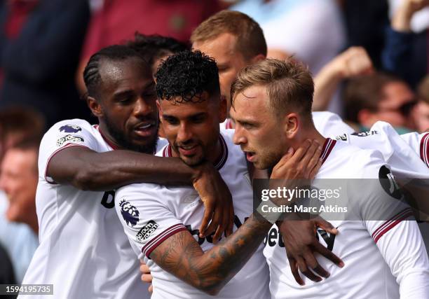 Jarrod Bowen of West Ham United celebrates scoring a goal with Michail Antonio and Emerson Palmieri Dos Santos during the Premier League match...