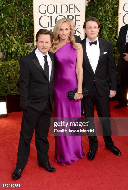 Actor Michael J. Fox, actress Tracy Pollan and Mr. Golden Globe Sam Fox arrive at the 70th Annual Golden Globe Awards held at The Beverly Hilton...