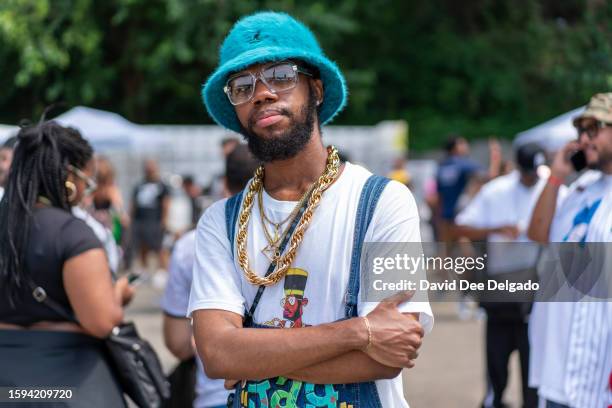 Person dressed in classic Hip Hop attire at a celebration for the fiftieth anniversary of Hip Hop on August 12, 2023 in The Bronx borough of New York...