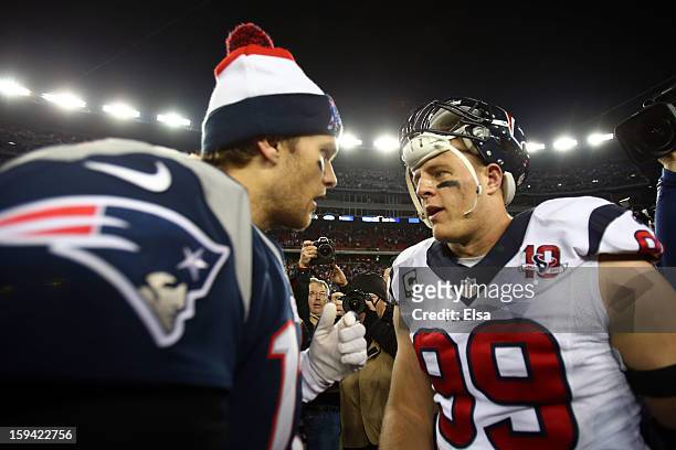 Tom Brady of the New England Patriots greets J.J. Watt of the Houston Texans after the 2013 AFC Divisional Playoffs game at Gillette Stadium on...