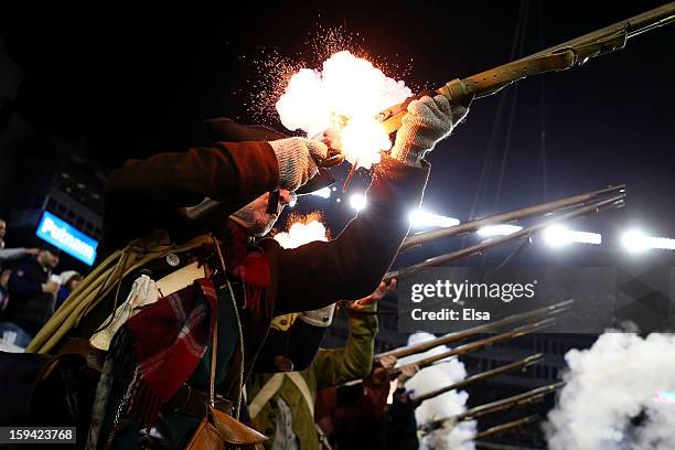 The "End Zone Militia" of the New England Patriots fire their guns during the 2013 AFC Divisional Playoffs game at Gillette Stadium on January 13,...