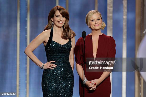 In this handout photo provided by NBCUniversal, L to R Tina Fey and Amy Poehler host the 70th Annual Golden Globe Awards at the Beverly Hilton Hotel...