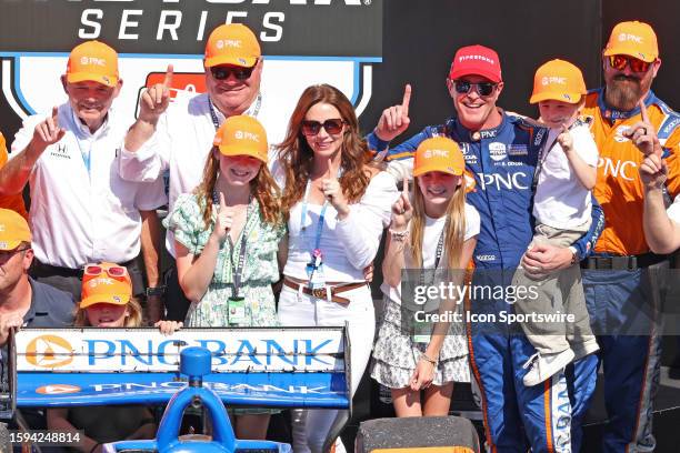 IndyCar driver Scott Dixon poses for photo with his wife Emma Davies-Dixon and their 3 children and car owner Chip Ganassi after winning the...